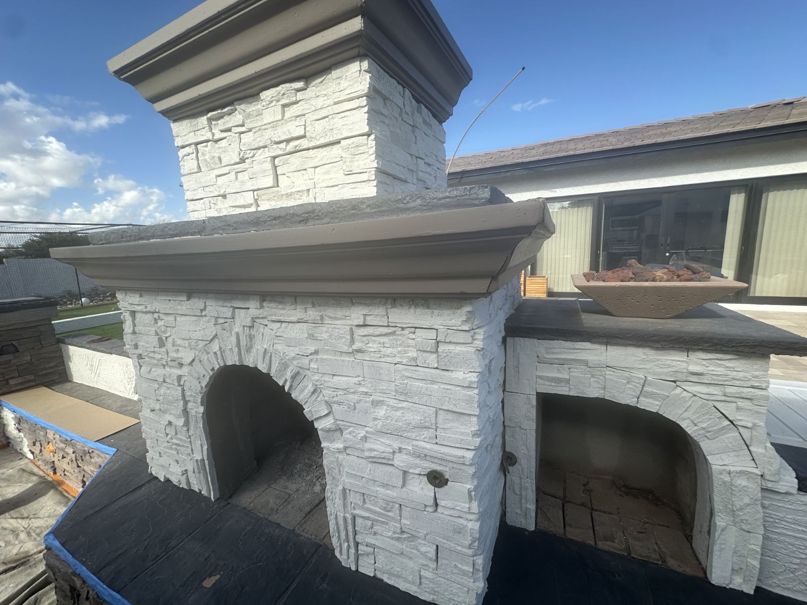 Exterior limewash on outdoor stone fireplace, Phoenix